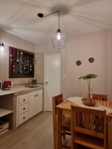 a kitchen with a table and a dining room at Marfil in Posadas