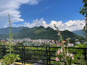 a view of a city with mountains in the background at Homestay 715 View Sapa in Sapa