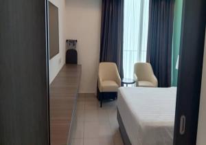 En eller flere senge i et værelse på Studio Suite Genting Highland 13A + 1 billede