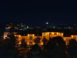 a night view of a building with lights at STAYCITY OTEL in Altındağ