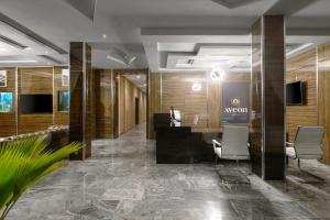TV a/nebo společenská místnost v ubytování Aveon Hotel