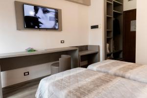 TV a/nebo společenská místnost v ubytování Hotel Casa Tra Noi