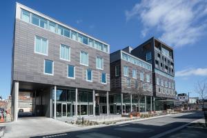 a rendering of a building on a city street at The Langlands Hotel in Invercargill