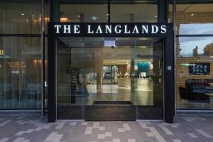 a store front with a sign that reads the landlords at The Langlands Hotel in Invercargill
