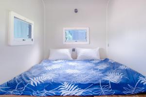 Voodi või voodid majutusasutuse Tai  Ping  Shan Inn toas