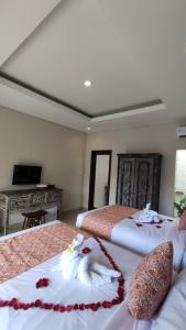 Kubu Garden Suites & Villas Nusa Dua客房内的一张或多张床位
