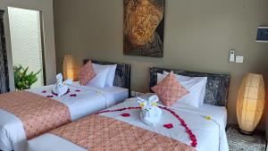 Kubu Garden Suites & Villas Nusa Dua客房内的一张或多张床位