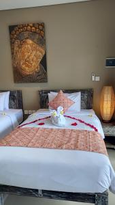 Kubu Garden Suites & Villas Nusa Dua客房内的一张或多张床位