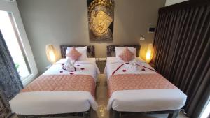 Kubu Garden Suites & Villas Nusa Dua客房内的一张或多张床位