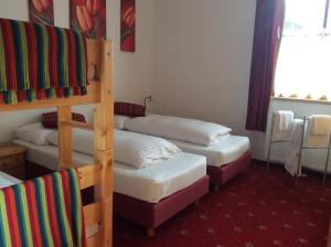 Łóżko lub łóżka w pokoju w obiekcie Kitz Residenz Top 6