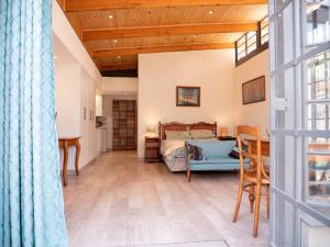 a bedroom with a bed and a wooden ceiling at Nature on the HIll in Harare