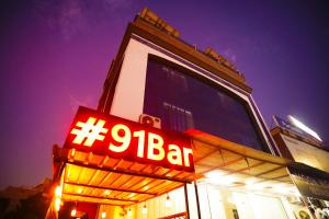 a sign for a bar in front of a building at Hotel Mansarovar Palace in Jaipur