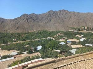 a view of a village with mountains in the background at Gam guest house 2 in Meghri