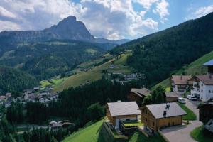a village in a valley with a mountain at Canalhof in Antermoia