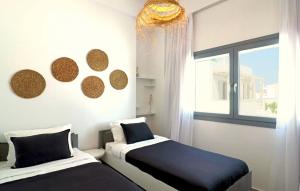 Posteľ alebo postele v izbe v ubytovaní The Nine Graces - Agios Prokopios Beach Apartments -Option with terrace and jacuzzi