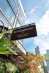 a sign in front of a building that says institutionophone at Volve Hotel Bangkok in Bangkok
