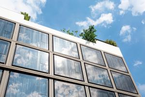 a building with many windows on the side of it at Volve Hotel Bangkok in Bangkok