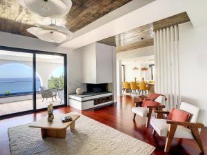 a living room with a view of the ocean at Unmei by LovelyStay in Caniço