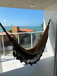 En balkong eller terrasse på Branco Haus - Pé na Areia do Caribessa