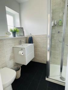 A bathroom at NEW! Beautiful contemporary property in Holt, Norfolk