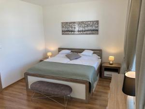 Postel nebo postele na pokoji v ubytování Apartmany Rubin Nesvady