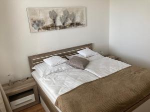 Postel nebo postele na pokoji v ubytování Apartmany Rubin Nesvady