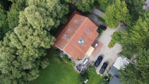 an overhead view of a large brick building with trees at Fewo Am Deich in Fehmarn
