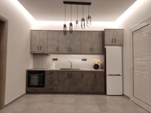Kuchyňa alebo kuchynka v ubytovaní Muoi Luxury Residences + 37 fotografií