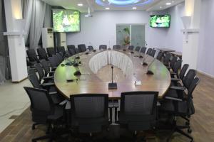 a large conference room with a large table and chairs at Murex Plaza Hotel & Suites in Monrovia