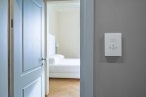 Postel nebo postele na pokoji v ubytování Hotel Ariele