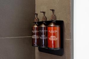 three fire hydrants are hanging on a wall at Volve Hotel Bangkok in Bangkok
