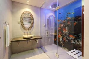 a bathroom with a sink and a shower at Upgraded with Full Sea View Rimal 5 Suites - Entire 4 Bedroom - Beach Access in Dubai