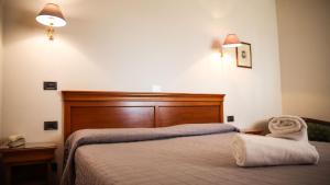 Postel nebo postele na pokoji v ubytování Bagno Santo Residence