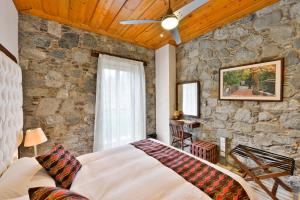 Postel nebo postele na pokoji v ubytování Vasilikis House