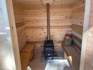 an inside view of a sauna with a stove at North Villge Hirugano - Vacation STAY 21286v in Gujo
