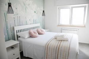 A bed or beds in a room at Perla Vacanza