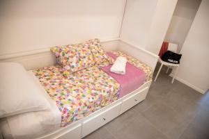 A bed or beds in a room at Perla Vacanza