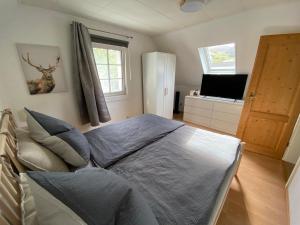 Giường trong phòng chung tại Schmallenberger Ferienhaus