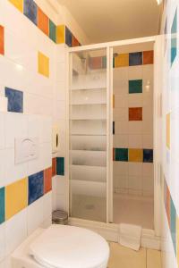 a bathroom with a toilet and a shower at Appartements Vivo in Cagnes-sur-Mer +27 photos