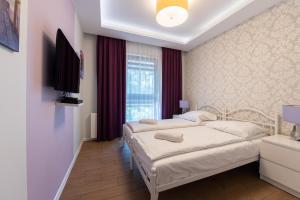 Ένα ή περισσότερα κρεβάτια σε δωμάτιο στο Santorini - Nadmorze