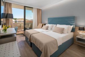 Krevet ili kreveti u jedinici u okviru objekta Valamar Meteor Hotel