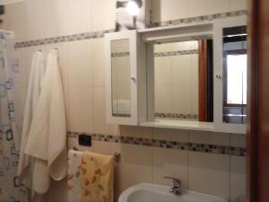 a bathroom with a sink and a mirror at Da Antonio in Càbras
