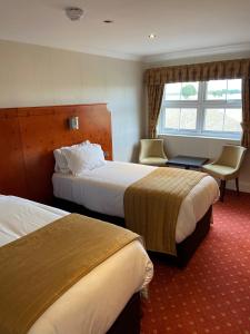 Loftsome Bridge Hotel客房内的一张或多张床位