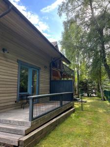 a front porch of a house with a deck at Rugio namai-Rye house in Palanga