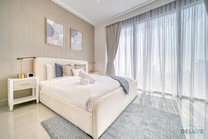 Postel nebo postele na pokoji v ubytování Extravagant 1BR at Opera Grand Downtown Dubai by Deluxe Holiday Homes