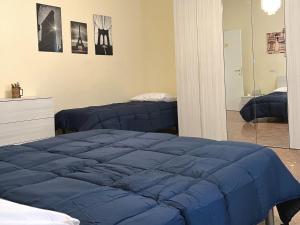 A bed or beds in a room at Palazzo Senesi