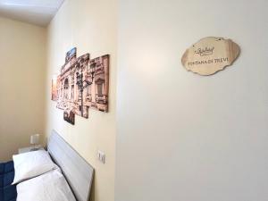 A bed or beds in a room at Palazzo Senesi