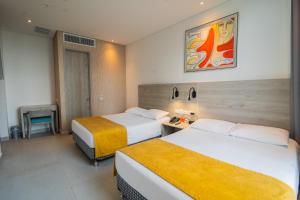 Postel nebo postele na pokoji v ubytování Hotel Zi One Luxury