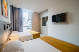 Postel nebo postele na pokoji v ubytování Hotel Zi One Luxury