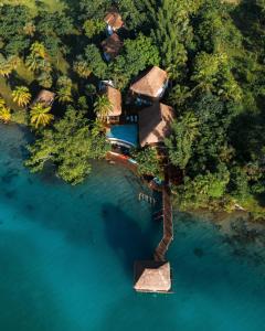 an aerial view of a resort on a island in the water at Khaban Bacalar Hotel Boutique in Bacalar